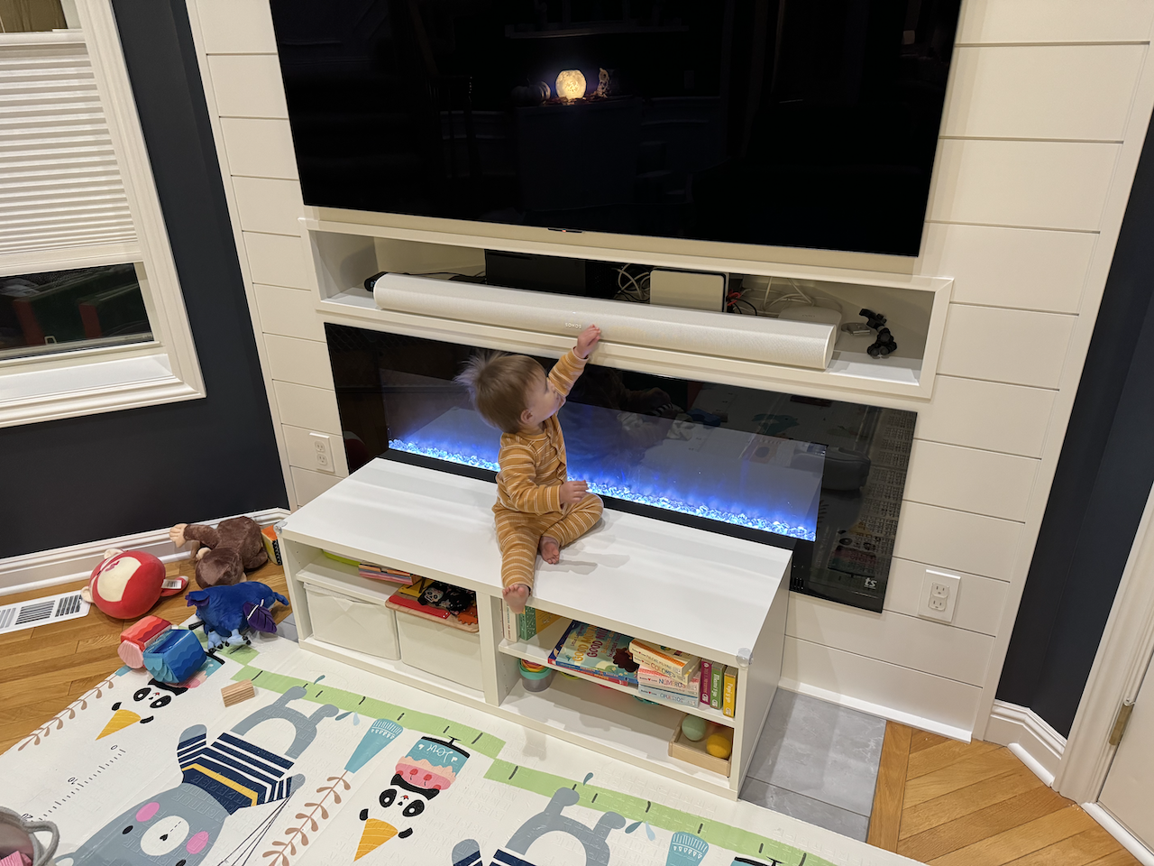 Zoe climbing on her toy stand.